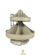 A light gray plastic kitchen accessory, likely a strainer basket or filter cone, resting on a black utility table in a storage room with cardboard boxes in the background.