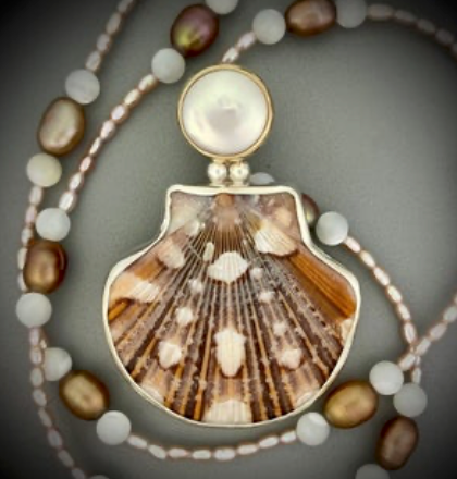 Flat Scallop Shell and freshwater coin pearl set in sterling silver and 14 karat gold on a freshwater pearl and mother of pearl chain. (1)